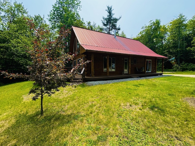 362 N Raymond Rd, Poland, ME 04274 - back of house with a lawn, a metal roof, and covered porch