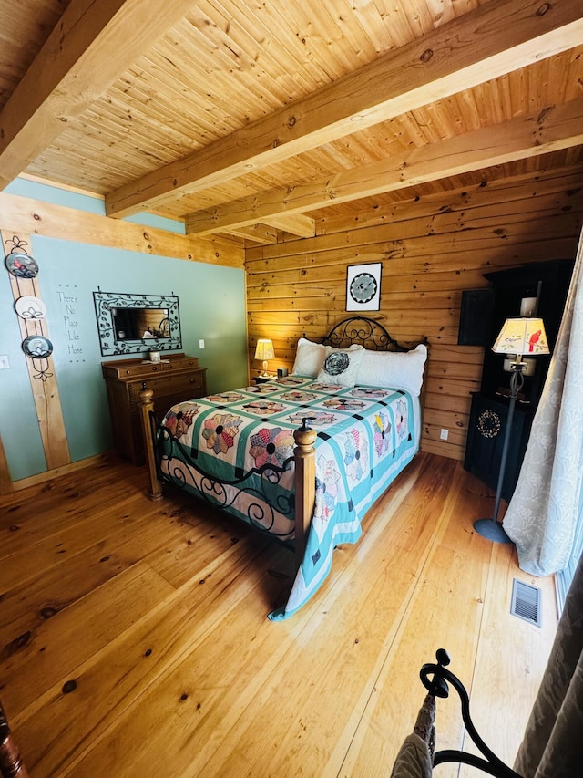 362 N Raymond Rd, Poland, ME 04274 - bedroom with hardwood / wood-style floors, wood walls, and a wooden ceiling with exposed beams