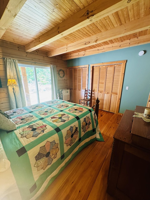 362 N Raymond Rd, Poland, ME 04274 - bedroom with a wood ceiling with exposed beams, light wood-type flooring, and multiple closets