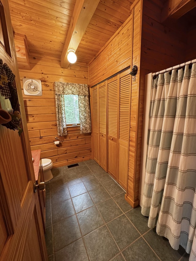 362 N Raymond Rd, Poland, ME 04274 - bathroom with wood walls, a wooden ceiling with exposed beams, tile patterned flooring, and a shower with curtain