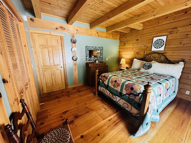 362 N Raymond Rd, Poland, ME 04274 - bedroom featuring hardwood / wood-style floors, a wood ceiling with exposed beams, and wood walls