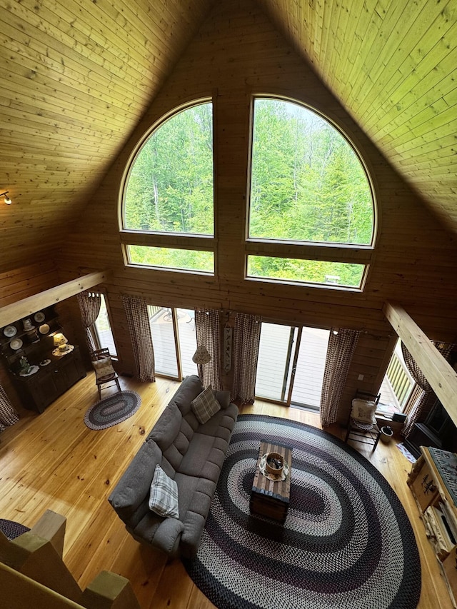 362 N Raymond Rd, Poland, ME 04274 - living room with high vaulted ceiling, wooden ceiling, wood walls, and wood-type flooring