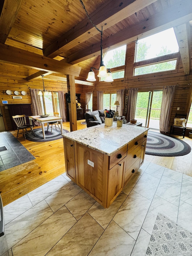 362 N Raymond Rd, Poland, ME 04274 - kitchen with wood ceiling, a chandelier, wood walls, pendant lighting, and open floor plan