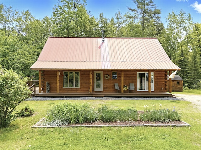 362 N Raymond Rd, Poland, ME 04274 - log home featuring log exterior, a front lawn, covered porch, and a metal roof