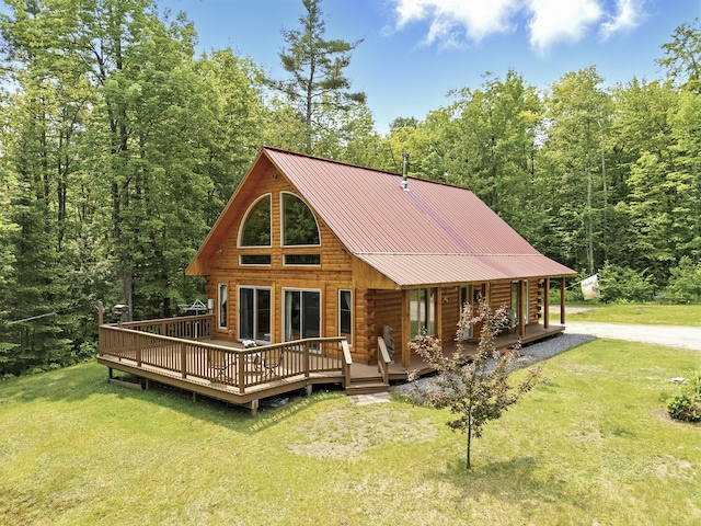 362 N Raymond Rd, Poland, ME 04274 - back of property featuring a yard, log siding, a metal roof, and a wooded view