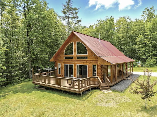 362 N Raymond Rd, Poland, ME 04274 - rear view of property featuring log siding, a yard, a view of trees, and a metal roof