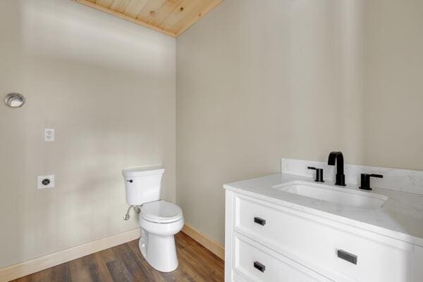 18 Thayer Way, Bethel, ME 04217 - half bath with vanity, wood finished floors, wooden ceiling, and lofted ceiling