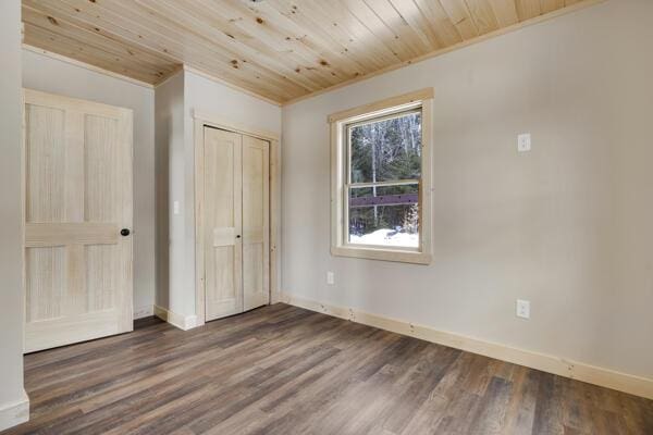 18 Thayer Way, Bethel, ME 04217 - unfurnished bedroom featuring wooden ceiling, dark wood-style floors, a closet, and crown molding
