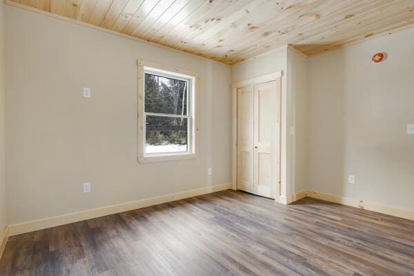 18 Thayer Way, Bethel, ME 04217 - unfurnished bedroom with wooden ceiling, wood finished floors, and a closet