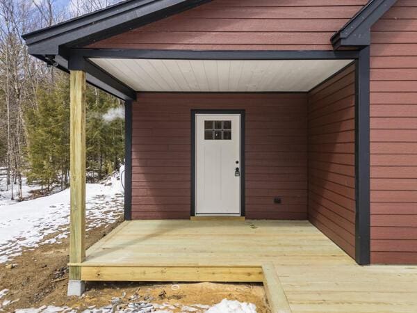 18 Thayer Way, Bethel, ME 04217 - snow covered property entrance featuring a deck