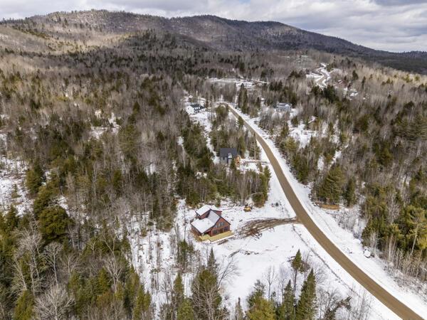 18 Thayer Way, Bethel, ME 04217 - snowy aerial view with a mountain view