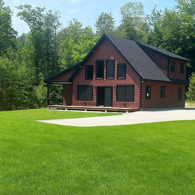 18 Thayer Way, Bethel, ME 04217 - rear view of property with a yard and a shingled roof
