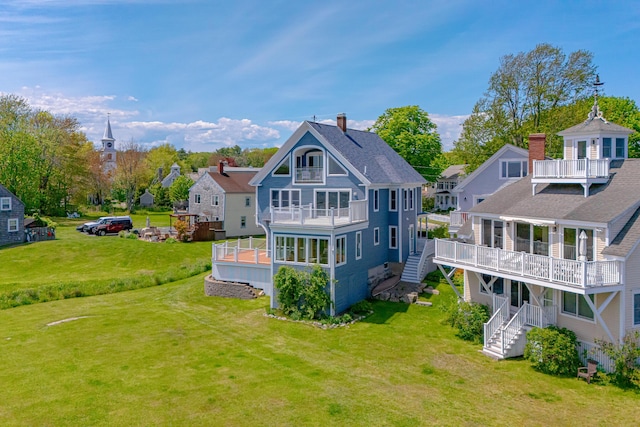 7 Pier Rd Unit 7, Kennebunkport, ME 04046 - rear view of property with a balcony, a deck, stairway, a yard, and a residential view