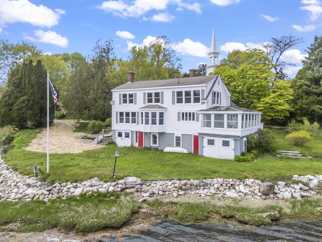 15 Church Ln, Phippsburg, ME 04562 - rear view of property with a sunroom, a chimney, a lawn, and a shingled roof