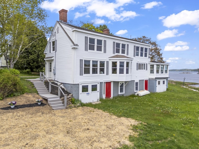 15 Church Ln, Phippsburg, ME 04562 - view of front of home featuring a chimney and a front lawn