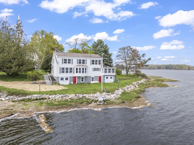 15 Church Ln, Phippsburg, ME 04562 - rear view of house with a water view, a chimney, and a yard