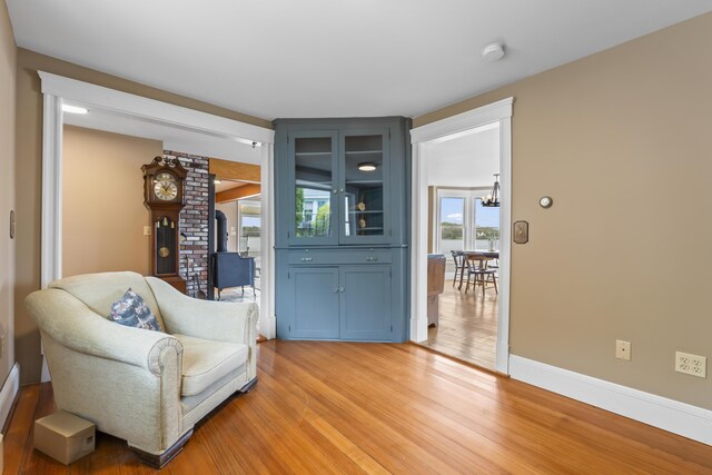 15 Church Ln, Phippsburg, ME 04562 - living area featuring light wood-type flooring, a wood stove, and baseboards