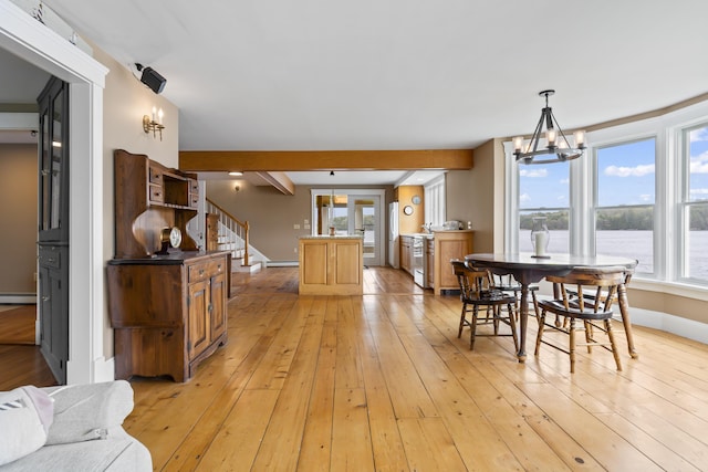 15 Church Ln, Phippsburg, ME 04562 - dining space featuring light wood-style floors, plenty of natural light, a chandelier, stairway, and beam ceiling