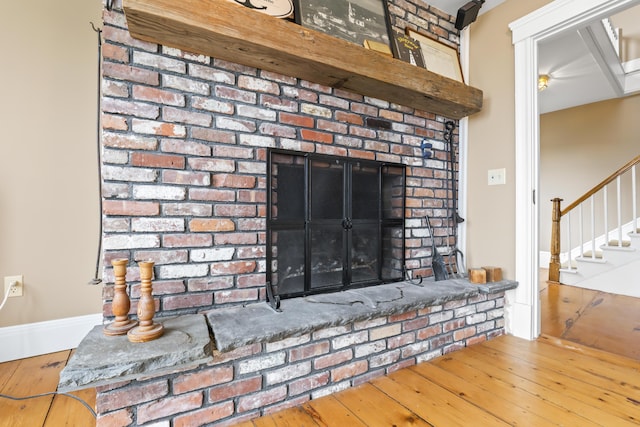 15 Church Ln, Phippsburg, ME 04562 - detailed view of wood finished floors and a brick fireplace