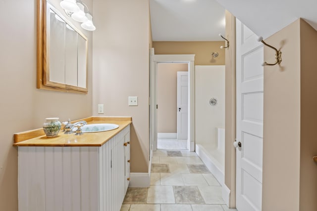 15 Church Ln, Phippsburg, ME 04562 - bathroom featuring a shower, vanity, baseboards, and tile patterned flooring
