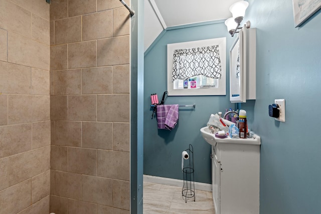 124 Brackett St, Westbrook, ME 04092 - full bath with vanity, marble finish floor, baseboards, and a tile shower