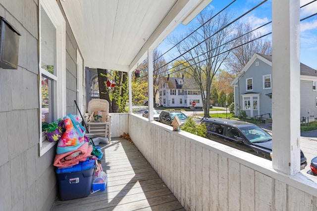 124 Brackett St, Westbrook, ME 04092 - wooden terrace featuring a porch and a residential view