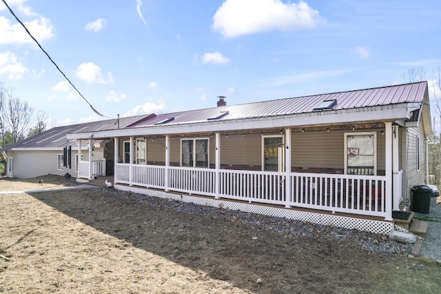 450 W Rd, Waterboro, ME 04087 - back of house featuring covered porch and metal roof