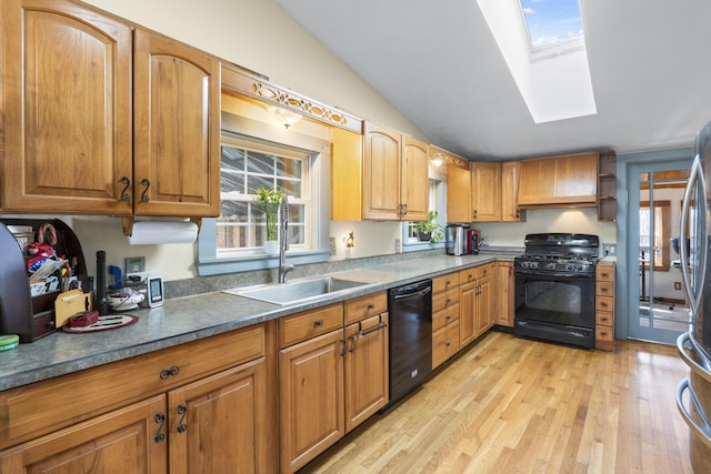 450 W Rd, Waterboro, ME 04087 - kitchen with black appliances, a skylight, light wood-style flooring, a sink, and custom range hood