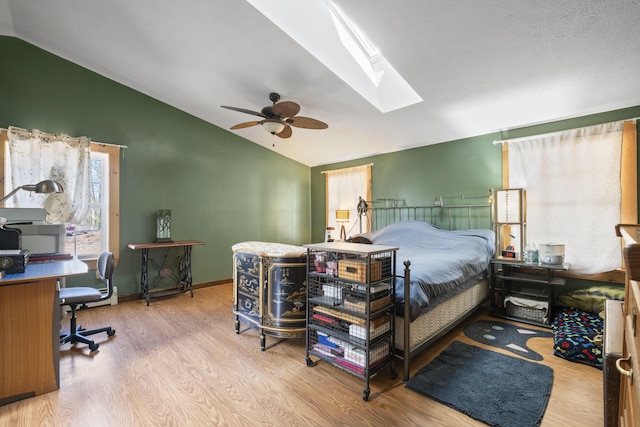 450 W Rd, Waterboro, ME 04087 - bedroom with lofted ceiling, wood finished floors, a skylight, ceiling fan, and an office area