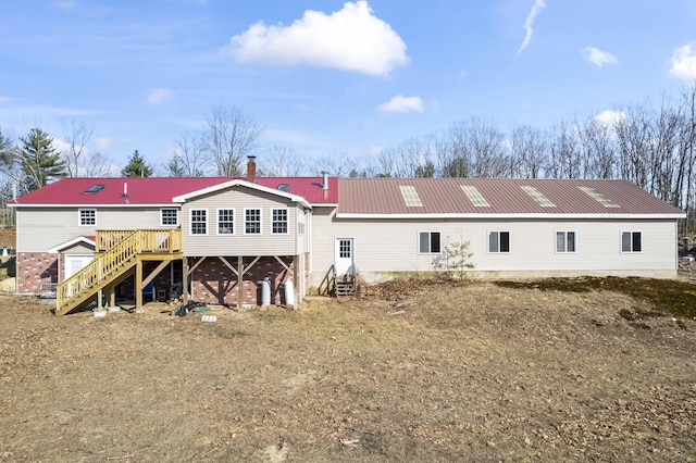 450 W Rd, Waterboro, ME 04087 - rear view of house featuring stairs, metal roof, and a wooden deck