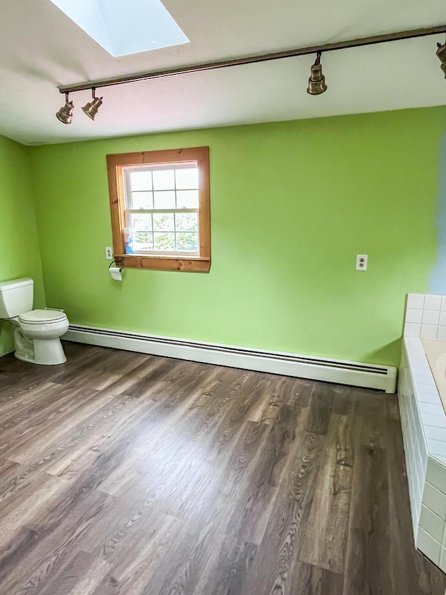 450 W Rd, Waterboro, ME 04087 - full bathroom with rail lighting, a baseboard radiator, toilet, and wood finished floors