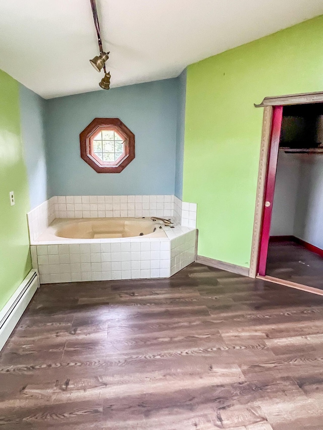 450 W Rd, Waterboro, ME 04087 - full bath featuring wood finished floors, a garden tub, track lighting, and a baseboard heating unit