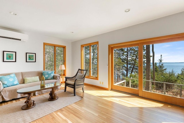 15 Eds Rd, Camden, ME 04843 - living area featuring a wall mounted AC, light wood-type flooring, a water view, and recessed lighting