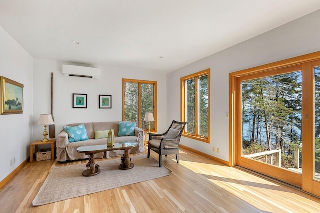 15 Eds Rd, Camden, ME 04843 - living room featuring a wall mounted AC and light wood finished floors