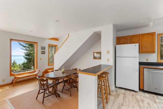 15 Eds Rd, Camden, ME 04843 - dining room with light wood finished floors and stairway