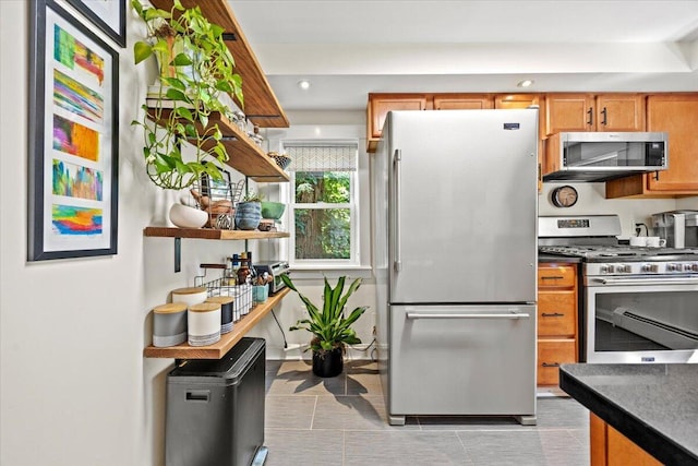 81 Forest Ave, Portland, ME 04101 - kitchen with stainless steel appliances, dark countertops, open shelves, recessed lighting, and light tile patterned floors