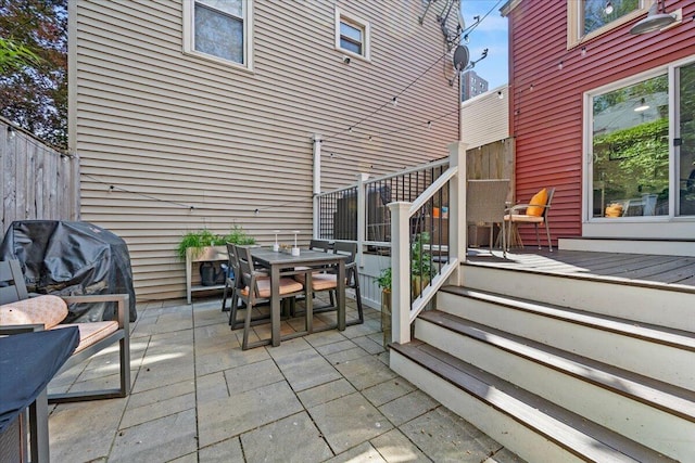 81 Forest Ave, Portland, ME 04101 - view of patio with outdoor dining space, a wooden deck, and a grill