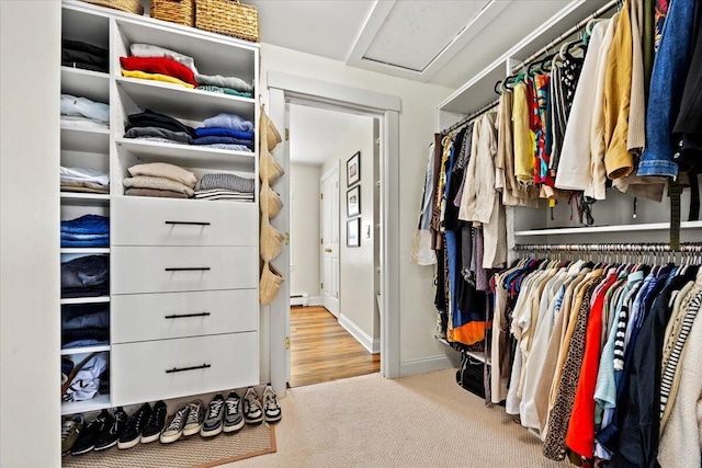 81 Forest Ave, Portland, ME 04101 - spacious closet with a baseboard radiator, carpet flooring, and attic access