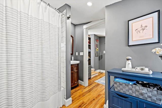 81 Forest Ave, Portland, ME 04101 - bathroom featuring wood finished floors, curtained shower, and vanity