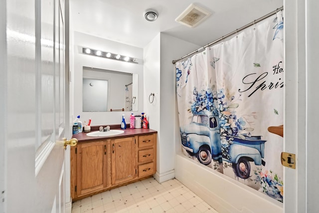 bathroom featuring tile patterned floors, vanity, shower / tub combo, and visible vents
