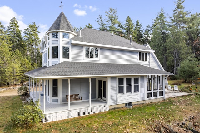 39 Catlin Shore Rd, Harpswell, ME 04079 - rear view of house with a yard, a shingled roof, covered porch, and central AC
