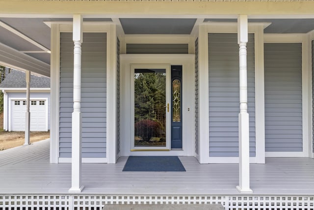 39 Catlin Shore Rd, Harpswell, ME 04079 - view of exterior entry featuring covered porch and a garage