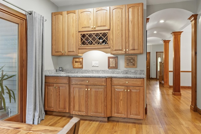 39 Catlin Shore Rd, Harpswell, ME 04079 - bar featuring ornate columns, arched walkways, and light wood-style floors