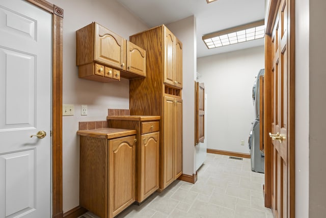 39 Catlin Shore Rd, Harpswell, ME 04079 - laundry area with stacked washing machine and dryer and baseboards