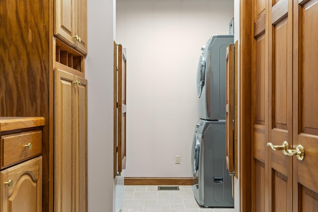 39 Catlin Shore Rd, Harpswell, ME 04079 - laundry room featuring stacked washer / dryer and baseboards