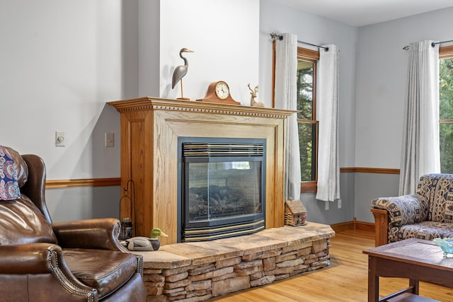 39 Catlin Shore Rd, Harpswell, ME 04079 - living area featuring wood finished floors and a glass covered fireplace
