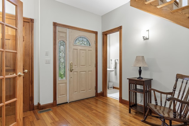 39 Catlin Shore Rd, Harpswell, ME 04079 - foyer entrance with light wood-style floors and baseboards