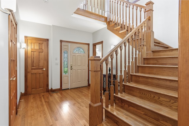 39 Catlin Shore Rd, Harpswell, ME 04079 - foyer featuring wood finished floors, stairway, and baseboards