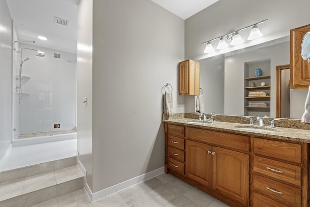 39 Catlin Shore Rd, Harpswell, ME 04079 - full bathroom featuring a shower stall, double vanity, tile patterned flooring, and baseboards