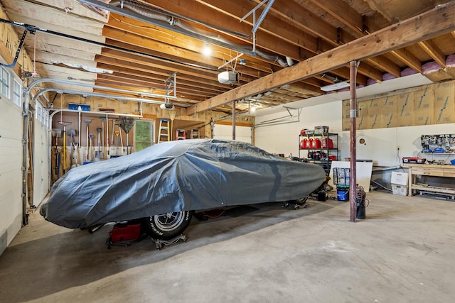 39 Catlin Shore Rd, Harpswell, ME 04079 - garage with a workshop area and a garage door opener